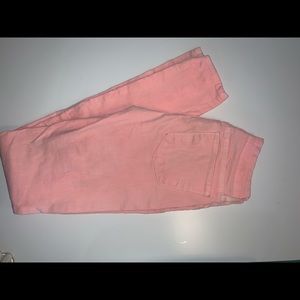 Peach colored denim pants